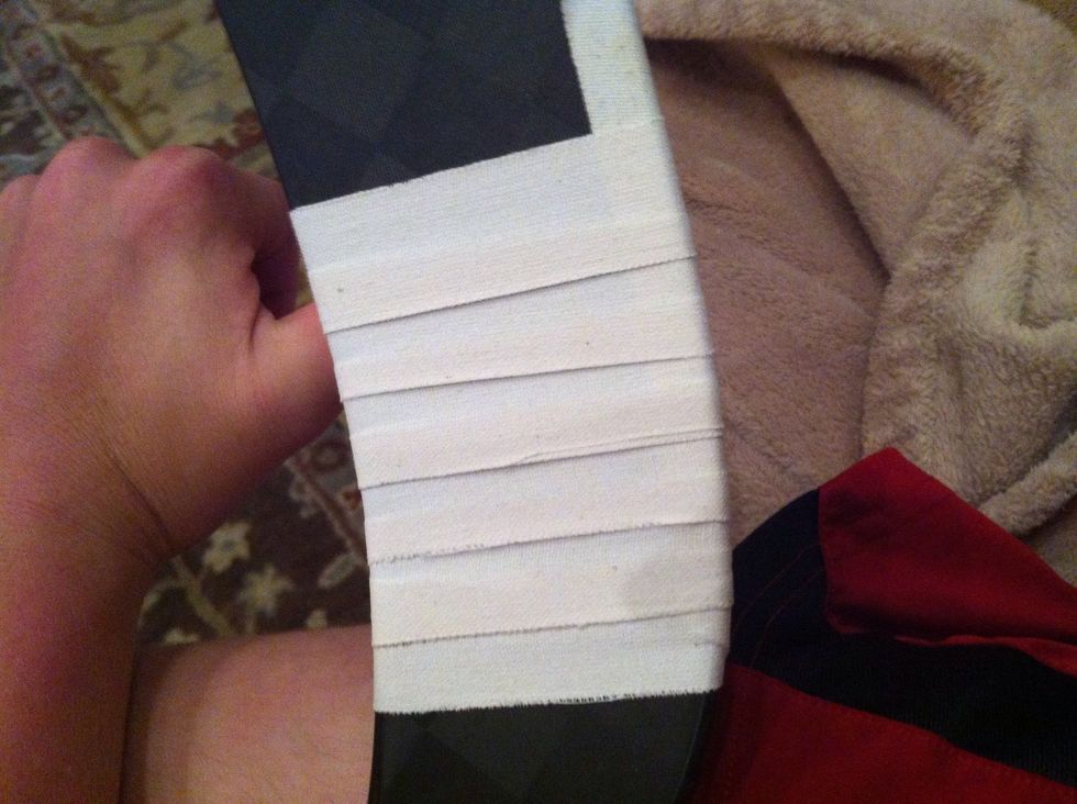 Make sure the each edge of the tape Is limbed up with the middle of the strip from the last wrap around.