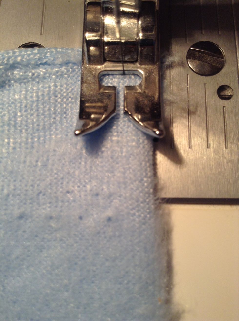 Make sure the fabric comes and stays at the edge of the presser foot while you are sewing. This creates about a 1/4 inch seam.
