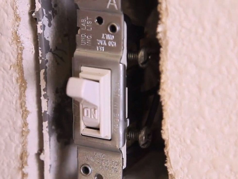 Make sure the light switch is properly orientated and tighten down the light switch.
