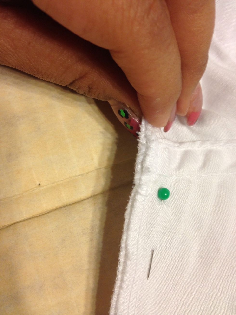 Make sure the sleeves are matched up at the armpit.