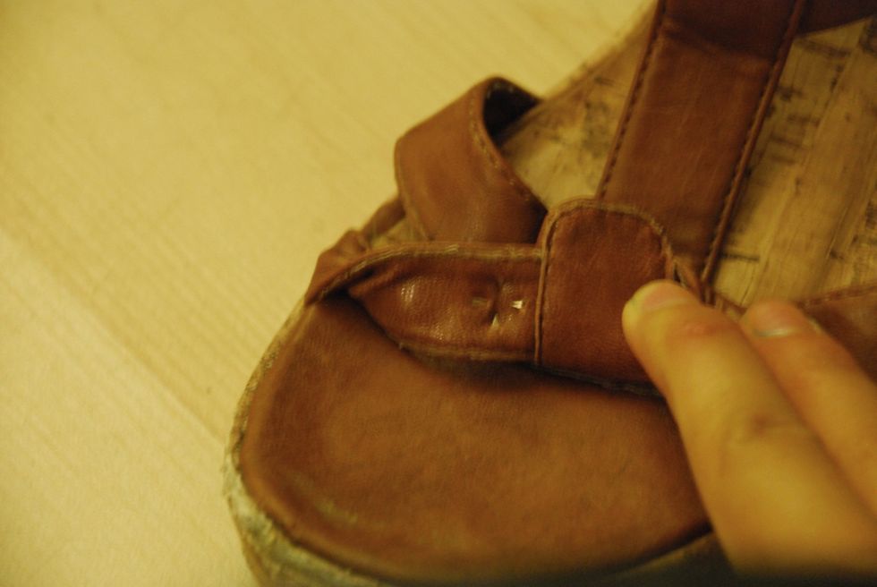 Make sure the studs are completely attached, use either your nails/a butter knife to push the prongs back. The prongs are super sharp, so be careful.