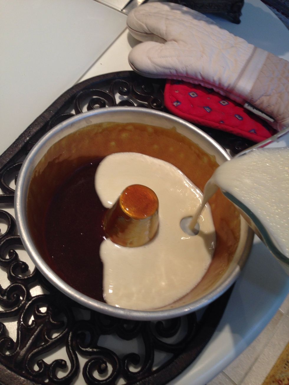 Make sure the sugar has cooled then add the blend to the sugar slowly until it is about a centimeter below the sugar edge.