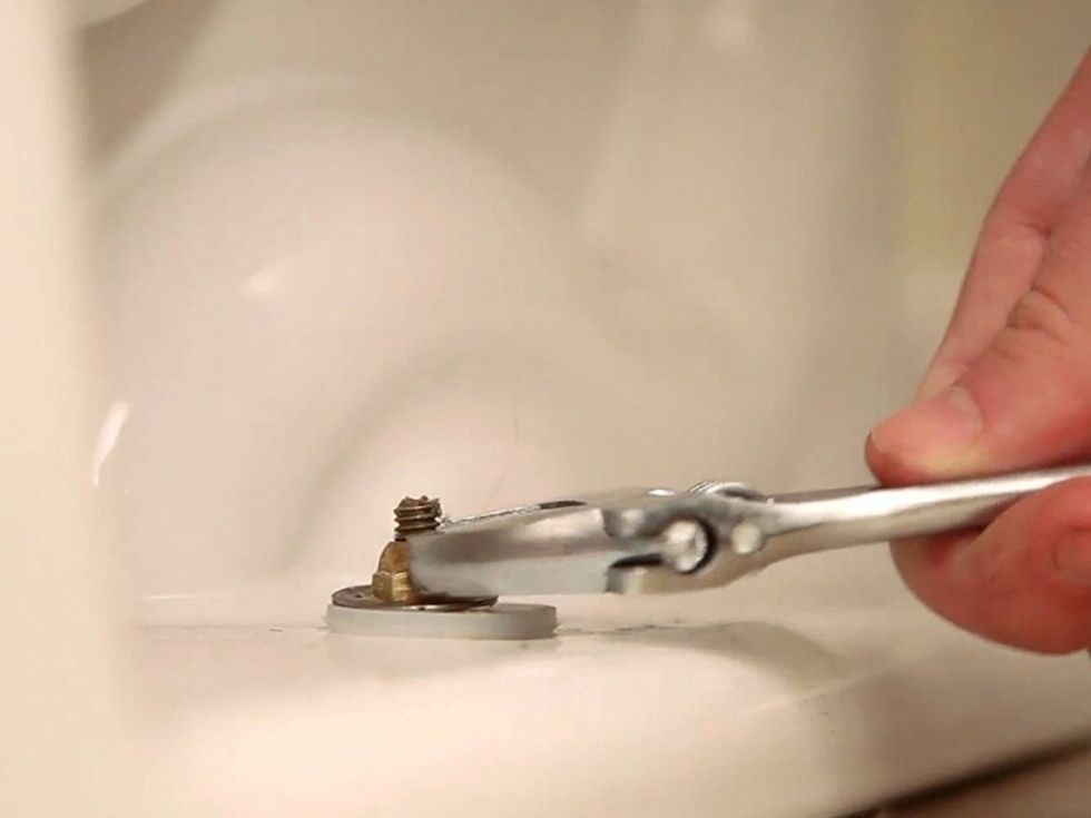Make sure the toilet is level before completely securing it down. When tightening the bolts, alternate from bolt to bolt to prevent cracking.