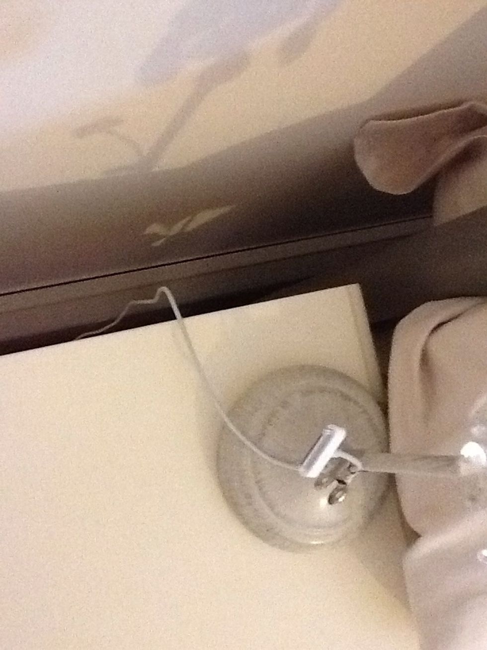 Make sure the wire goes down behind your night stand