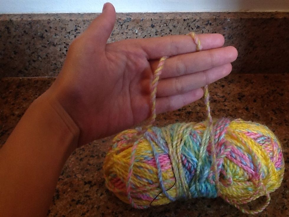 Make sure the yarn that is wrapped connects to the spool