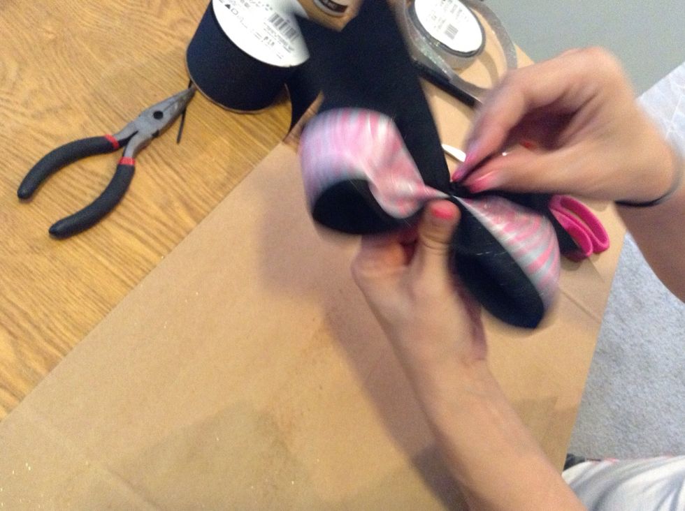 Make sure the zip tie closure is on the backside of the bow.