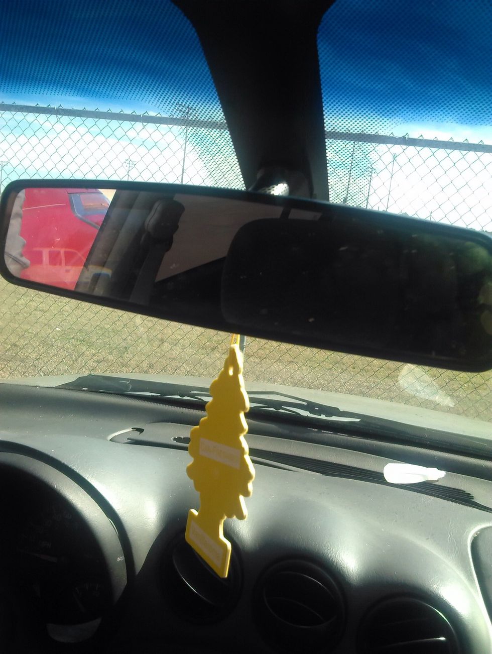 Make sure there is no one behind the car using the rear view mirror.