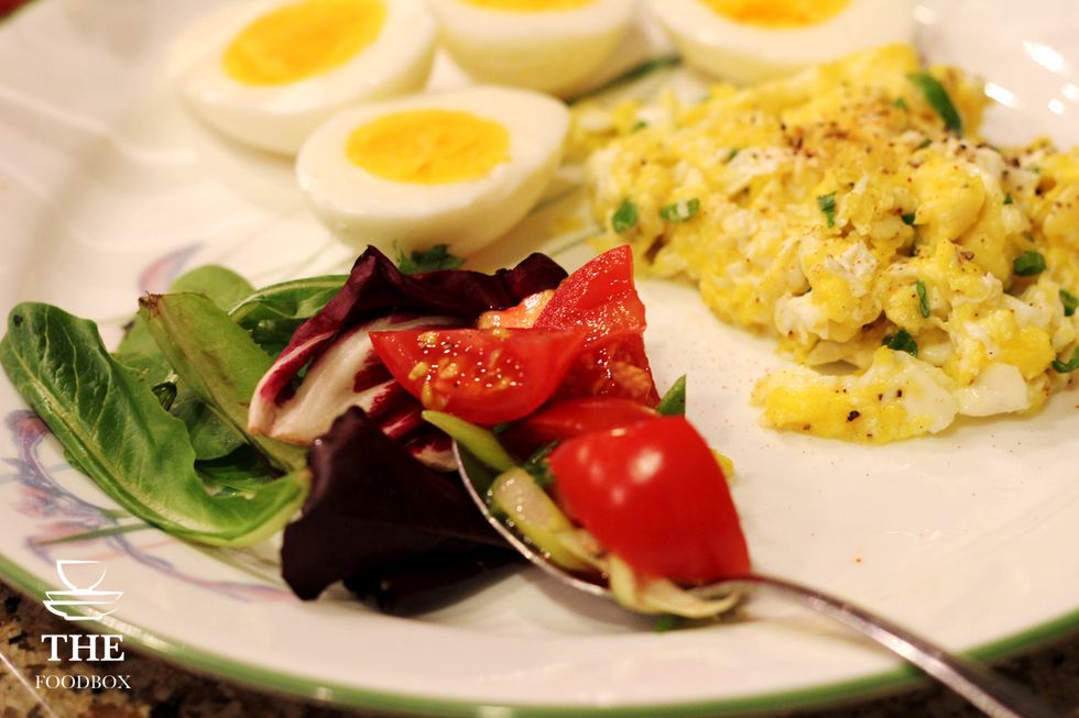 Make sure to boil your eggs and cook your scrambled eggs with the green onions. Assemble your spring mix and tomatoes.