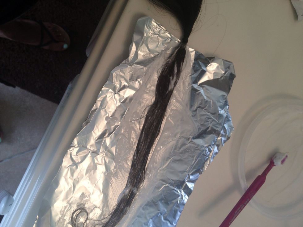 Make sure to cover all strands evenly to avoid streaking.