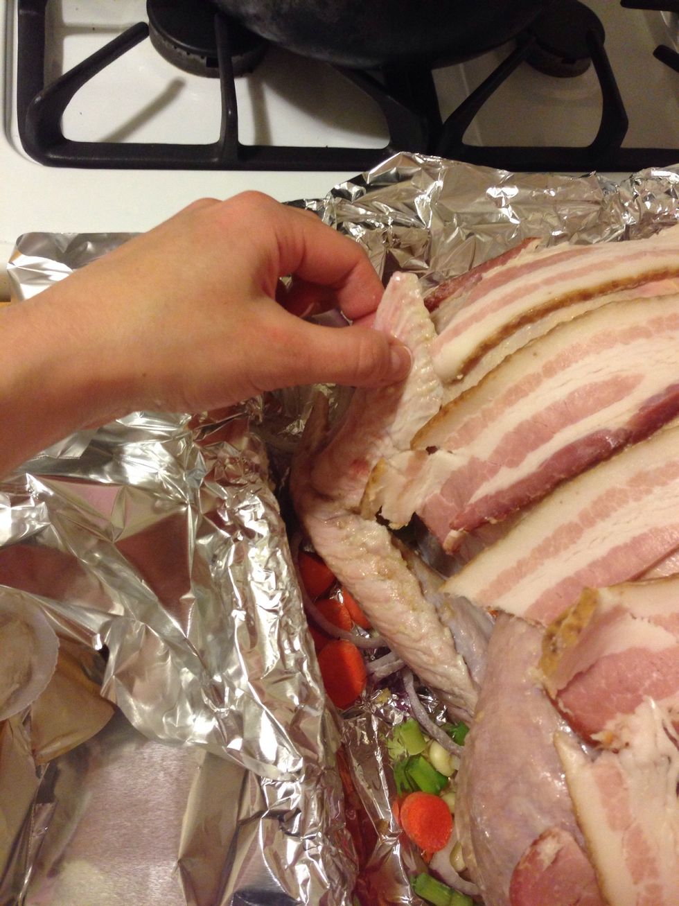 Make sure to fold the wings under the turkey so they don't burn.