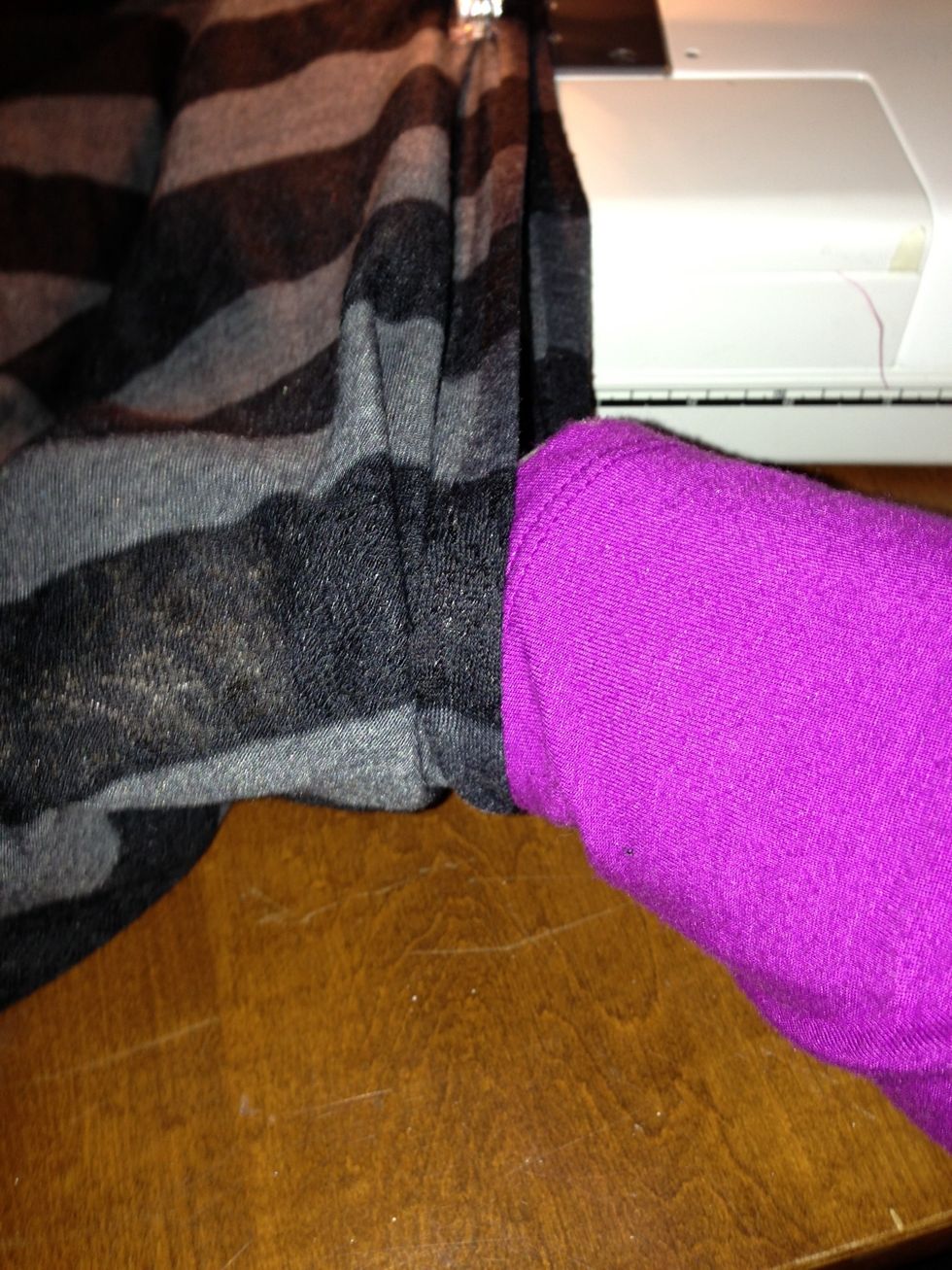 Make sure to sew the cuffs fit snugly by slipping your wrist into the hole and determining final end point. Remark with double pins as far as where to stop. Mark identical point on other side.