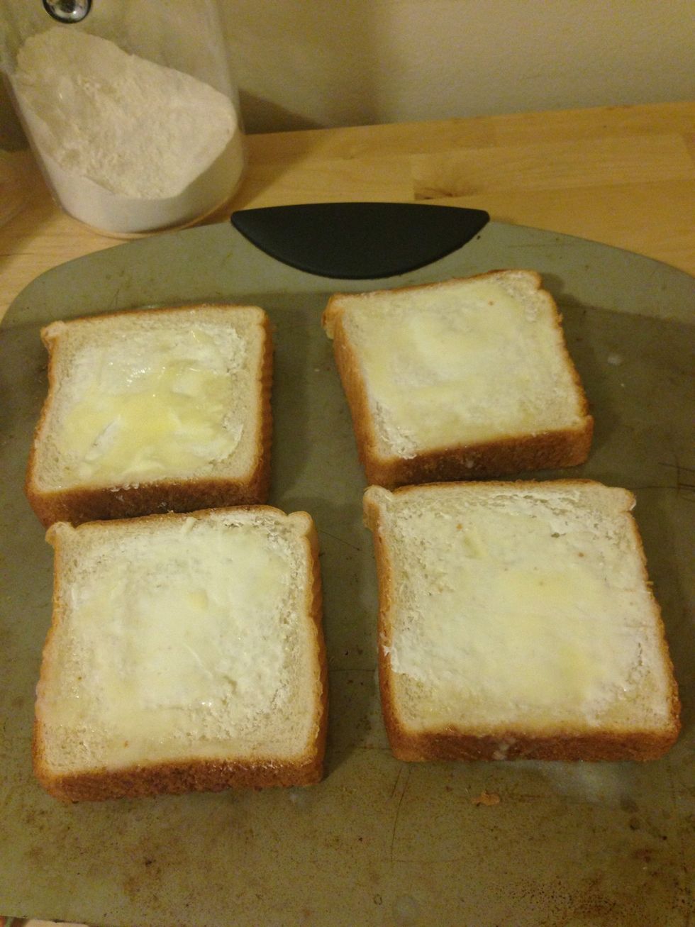 Make sure to spread the butter evenly across each slice.