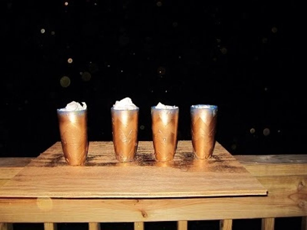 Make sure to tape the top lip of the glass so it's safe to drink. Then spray with the gold enamel in even coats.