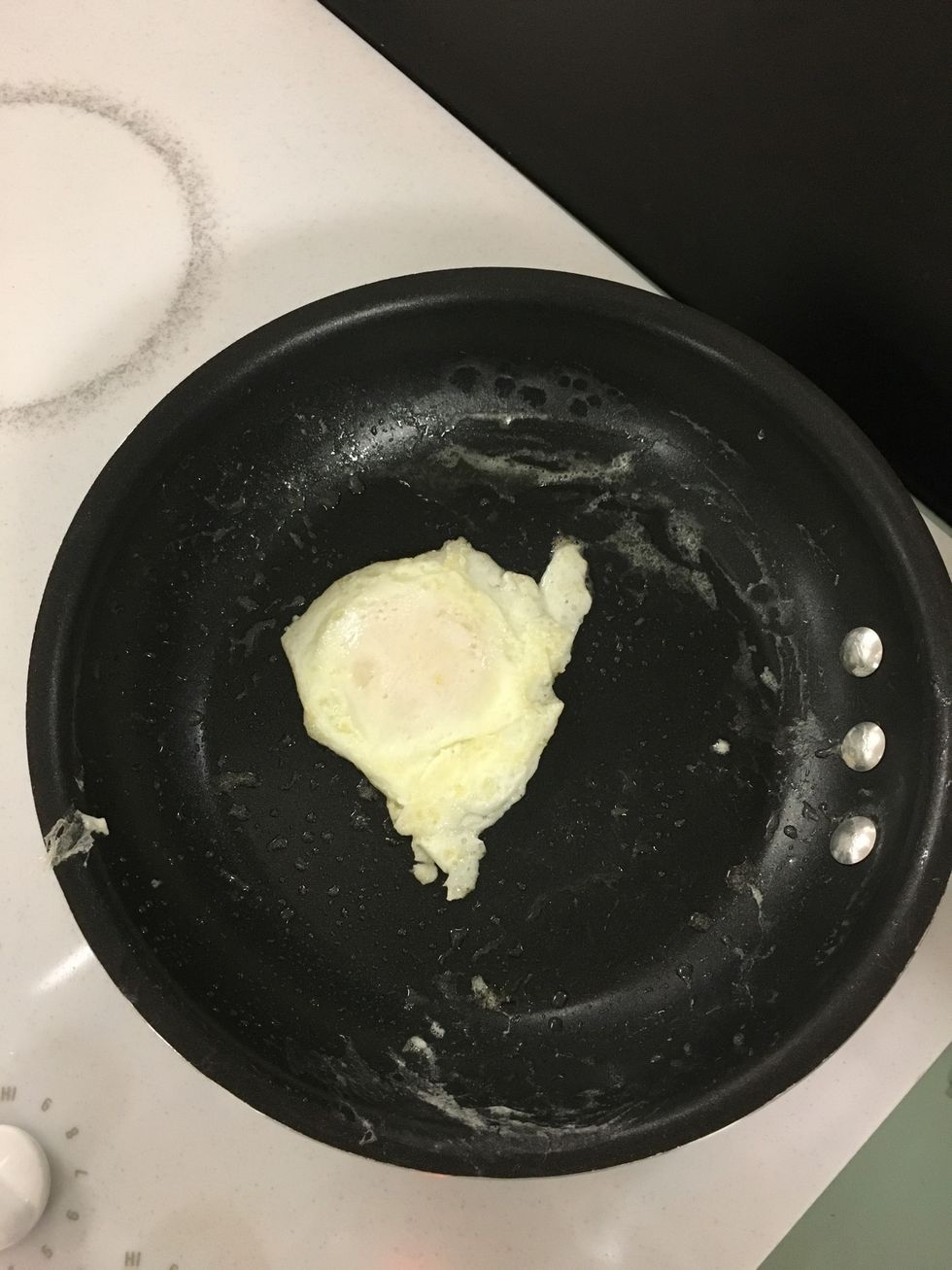 Make sure to watch the white part of the egg cook, so it doesn't burn. Once done, flip to the other side. *egg should not spend much time on this side