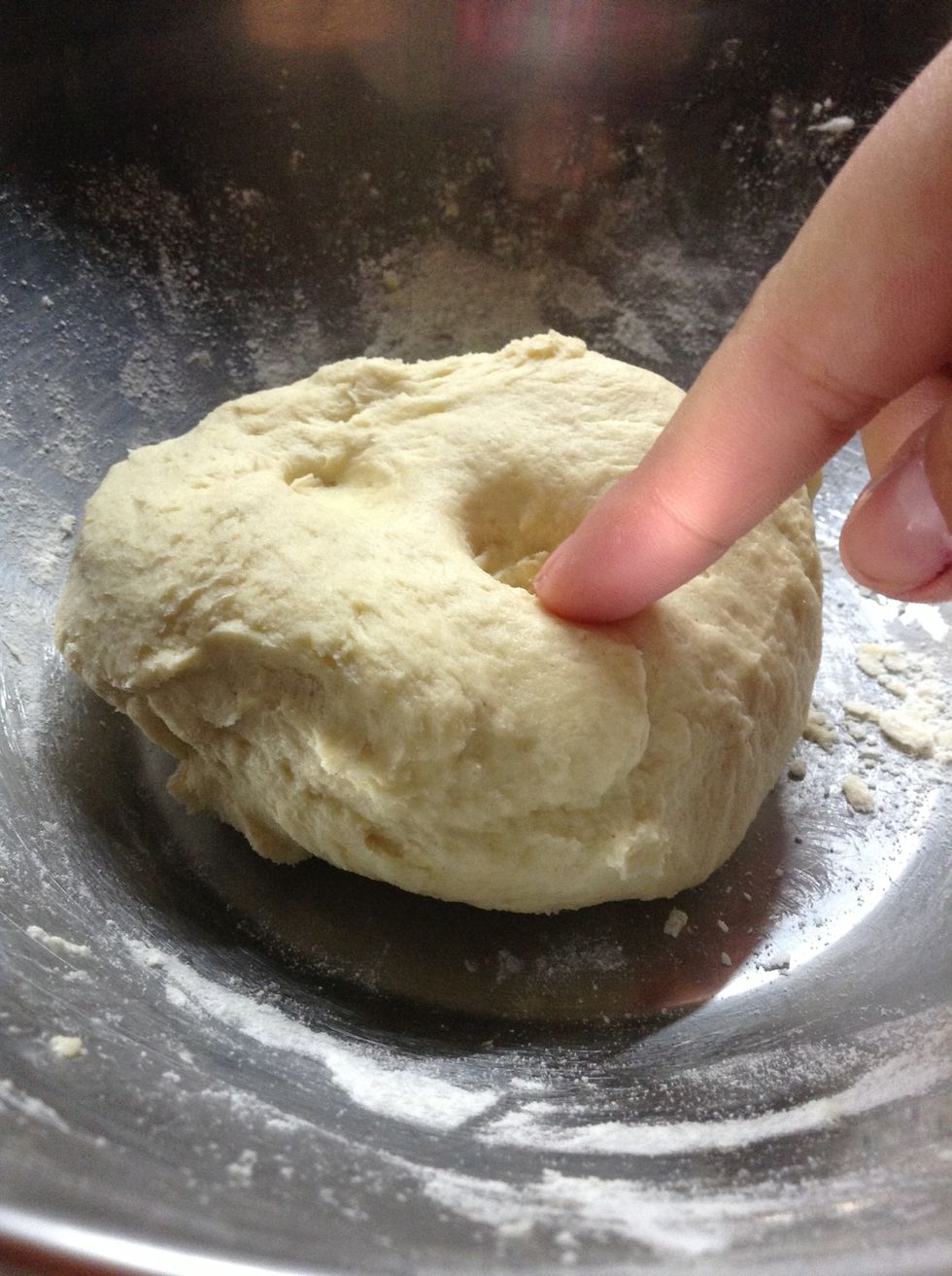 Make sure when you press a finger into the dough, it doesn't stick.