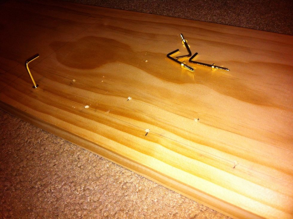 Make sure you choose the correct drill bit size. A size smaller than the screw works best. Drill away. Make sure not to go through too far otherwise it'll go straight through the entire piece of wood