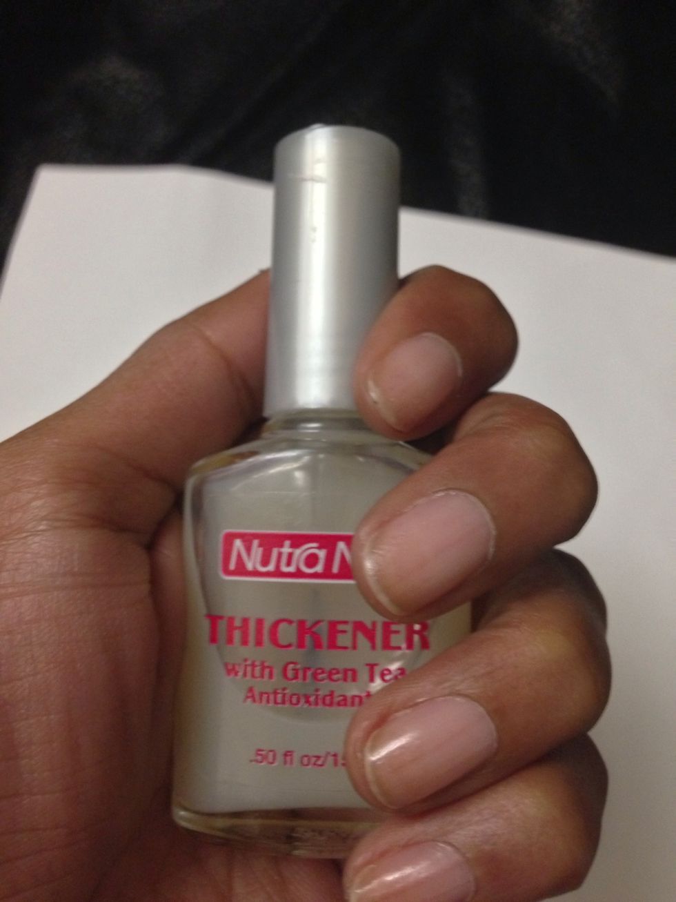 Make sure you clean, shape, and buff your nail first. Then apply a base coat and let dry. I am using Nutra Nail's Thickener.