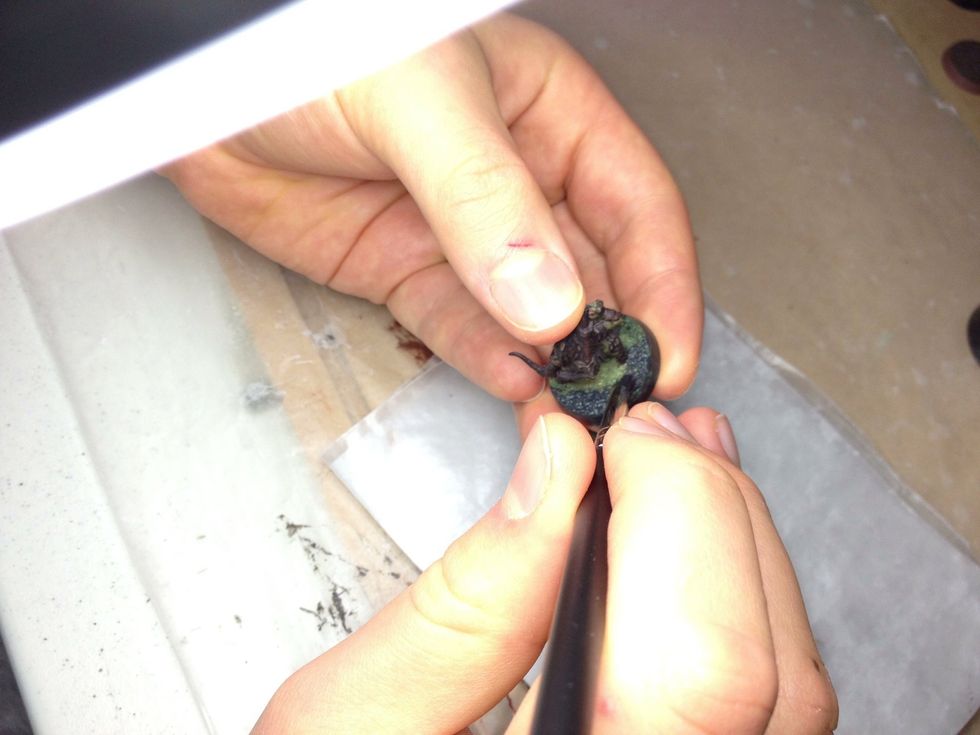 Make sure you cover all the sand with the primer. Priming the base is reasonably similar to priming the model.