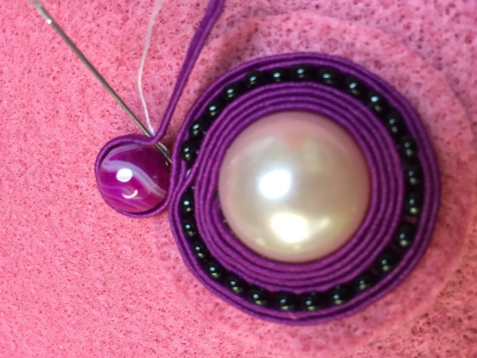 Make sure you hug your bead with the cording and tie securely in the back