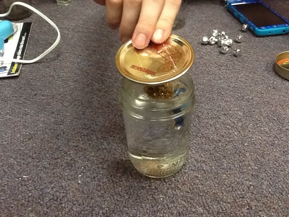 Make sure you screw on the lid to make sure it doesn't leak. Our jars have two separate parts so we screwed on an outside ring (make sure that the jar of water is on a level surface)