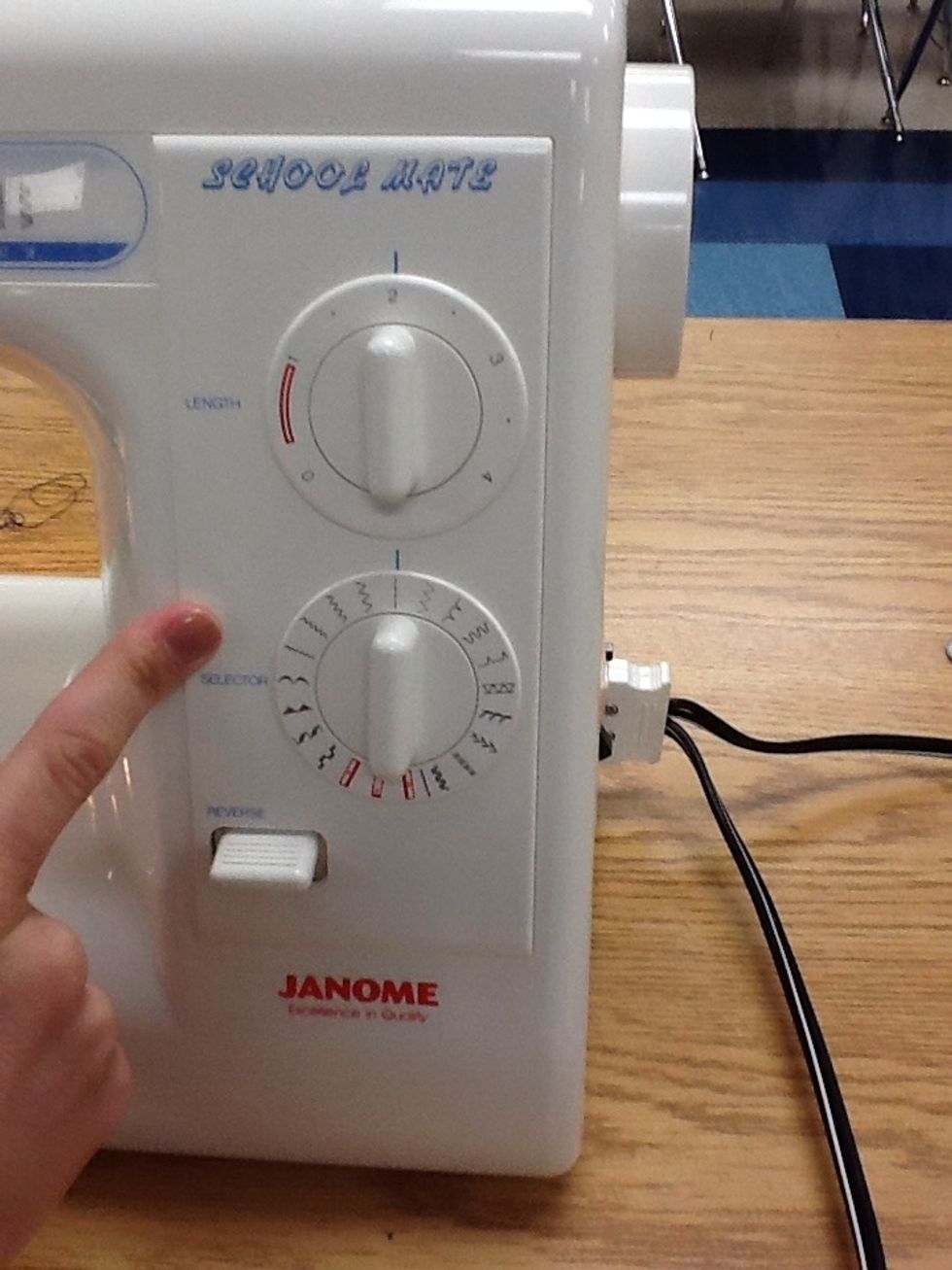 Make sure you Stitch selector knob is on the straight stitch Make sure your Stitch Length knob is turned to 2