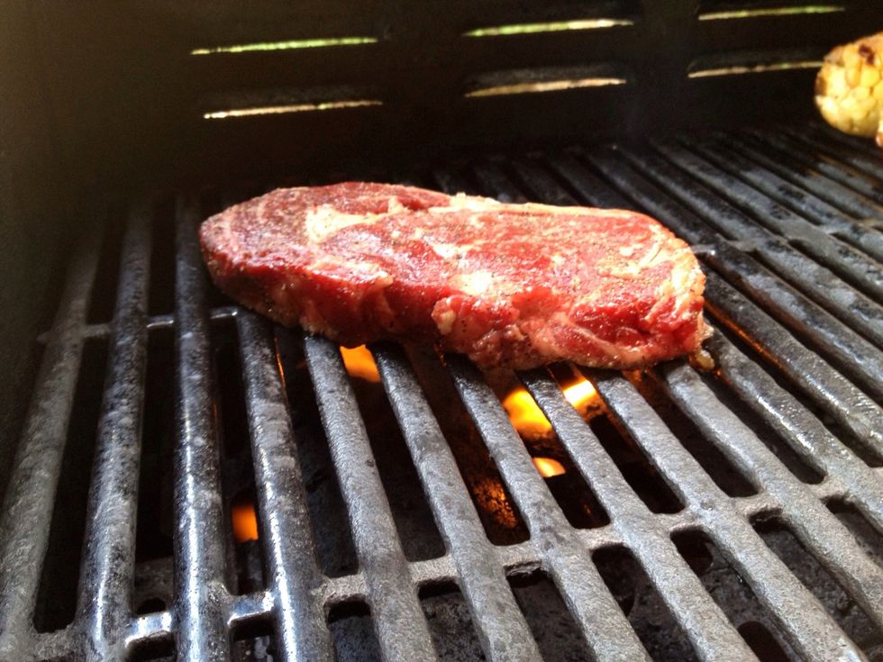 Make sure your grill is very very hot and oil the grates. Place the Steak on the grates.
