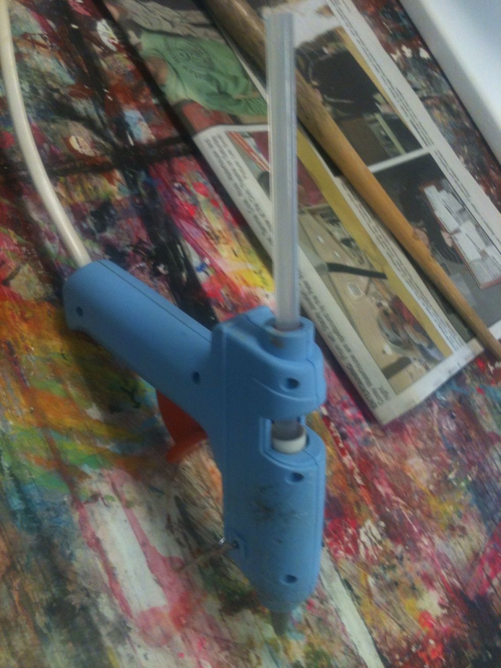 Make sure your hot glue gun is hot and ready. Make sure it is sitting on a board