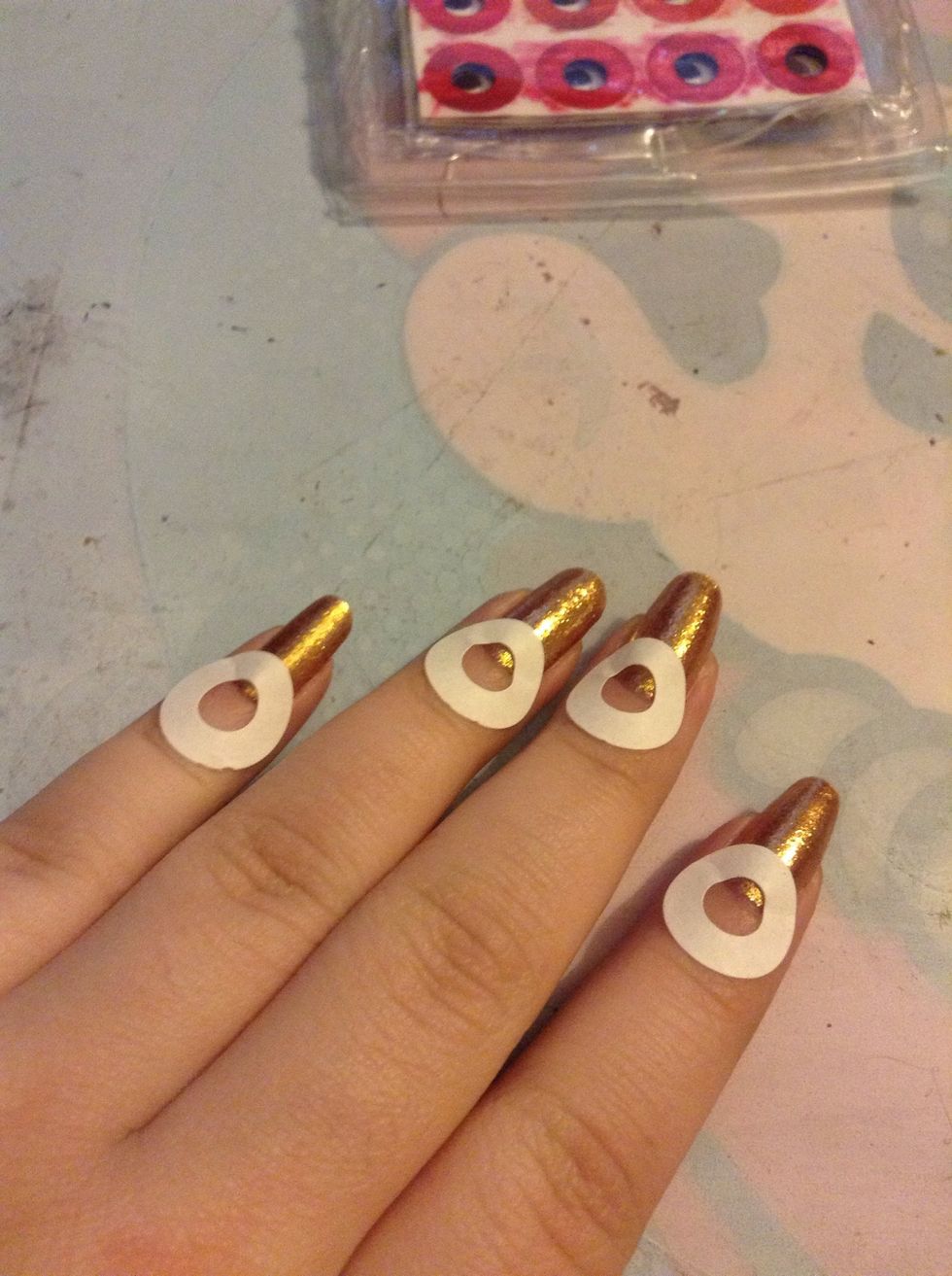 Make sure your polish is completely dry or the sticker will pull it up. Put them on like this.