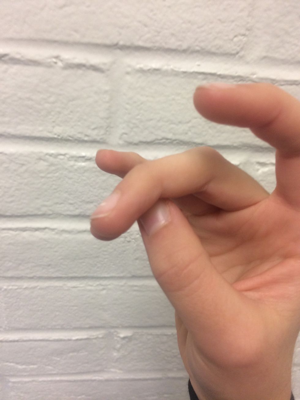 Make sure your thumb is under the ring and middle fingers.