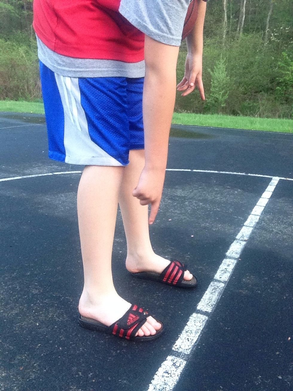 Make sure your toes are touching the free throw line