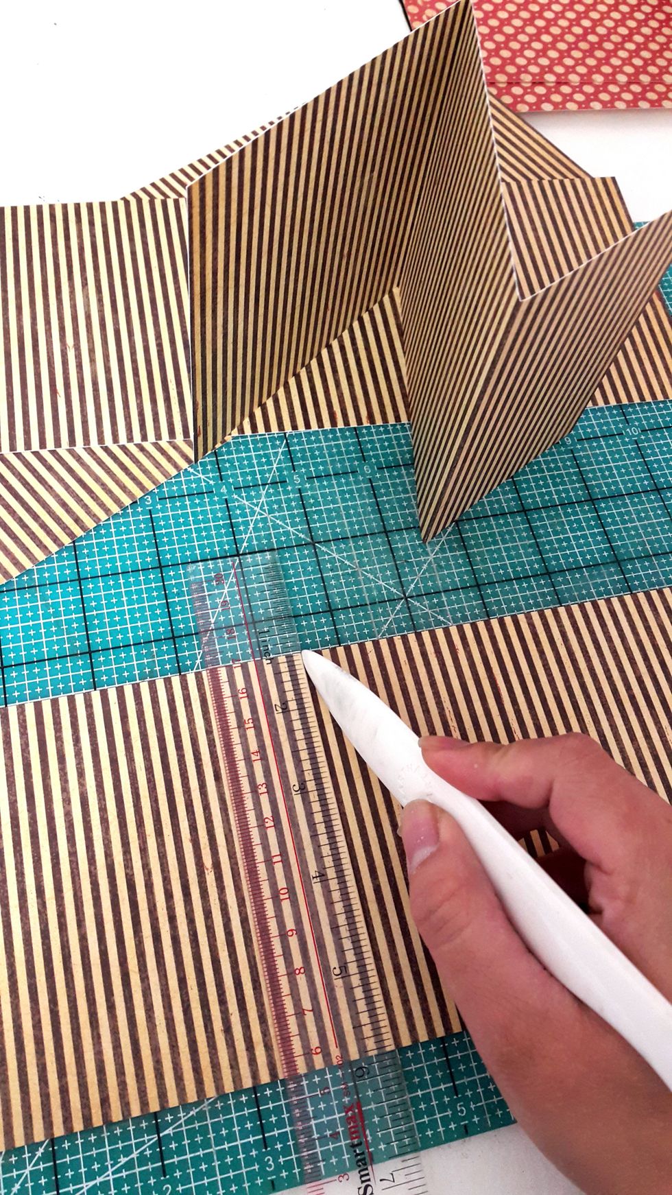 Make the accordion album insides pages with 4 \u00bd\u201d x 4 \u00bd\u201d, I used 4 strips and adhered them together.