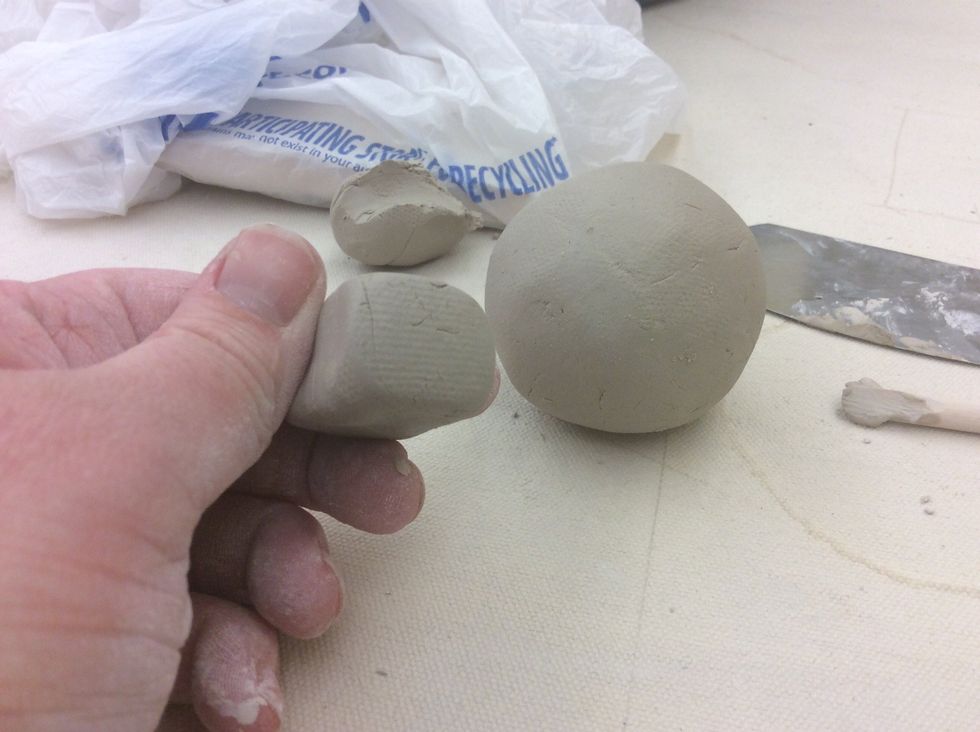 Make the ball into a rectangular cube. This will be your mouth piece.