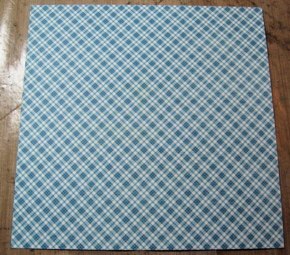 Make the covers: Cut TWO 6" squares for front & back cover. TWO 5 7/8" rectangles of patterned paper for inside covers. I worked with blue& yellow palette. Ink all edges with Vintage Photo Ink.