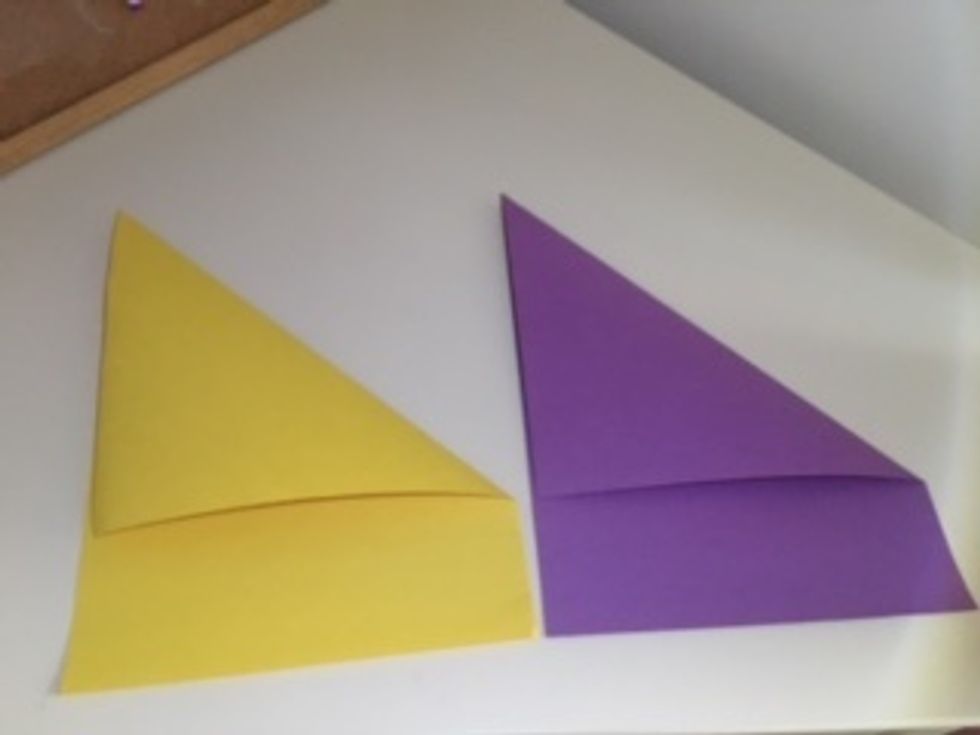 Make the creases tight. There should be a rectangle strip of excess paper on both.