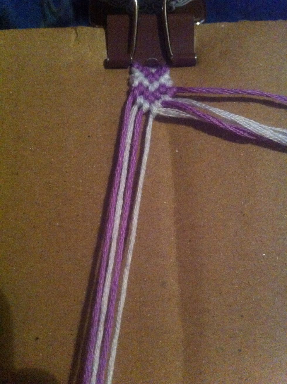 Make the first half of the heart by making forward knots with the first 3 strings.