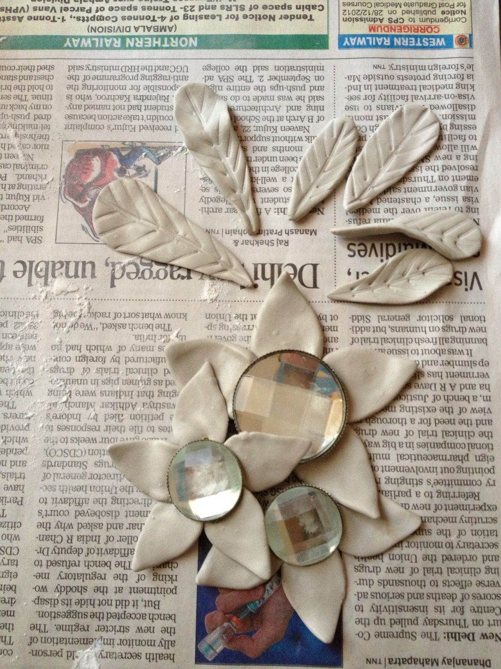 Make the flowers and leaves. Now wait for it to dry. Try curving the petals and leaves to give a more natural look. \ud83c\udf38\ud83c\udf3f\ud83c\udf43