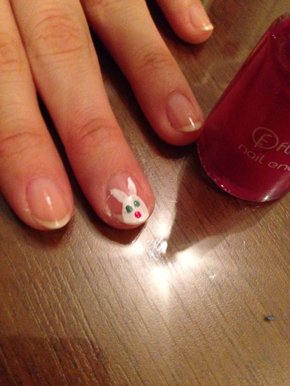 Make the pinky nose. Make a dot with the dark pink polish.