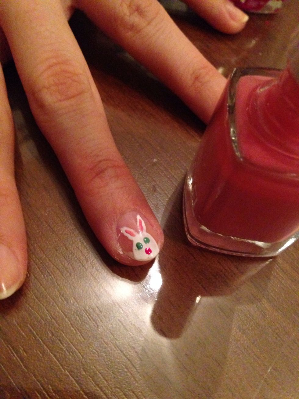 Make the pinky part of the ears. Use light pink polish and draw lines inside the ears.