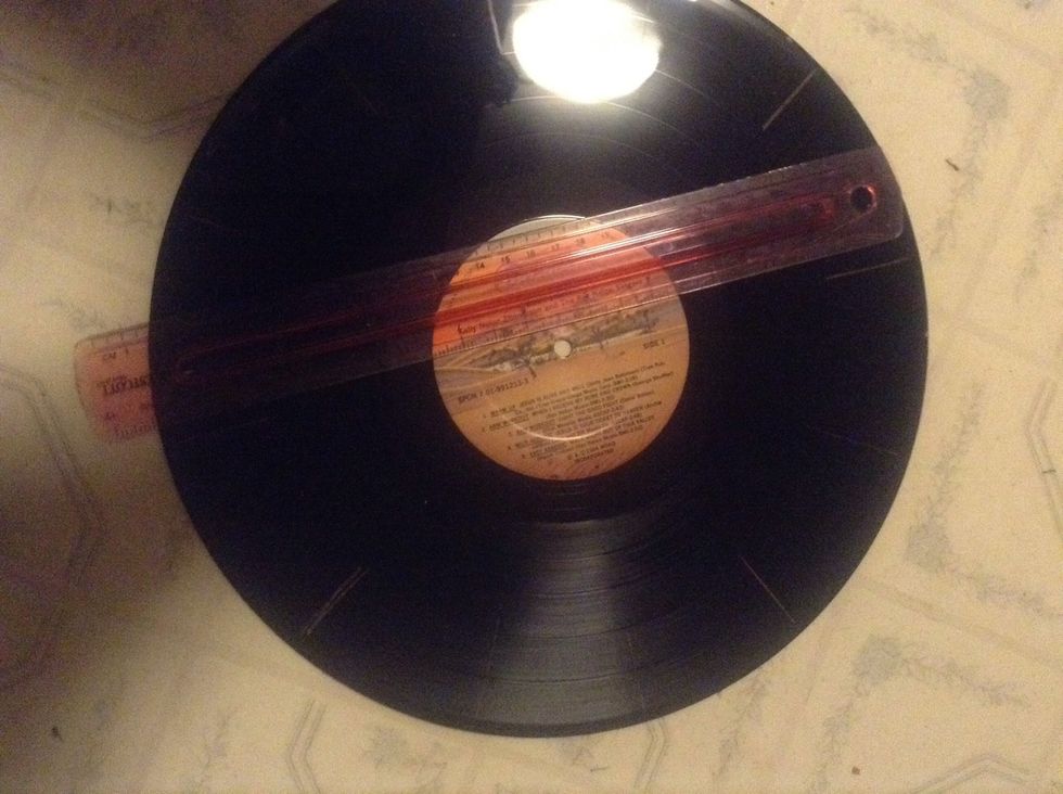 Make the rest of the marks where 1,2,4,5,7,8,10, and 11 will go. at this point, if you would like to decorate the record, color it with colored pencil. :)