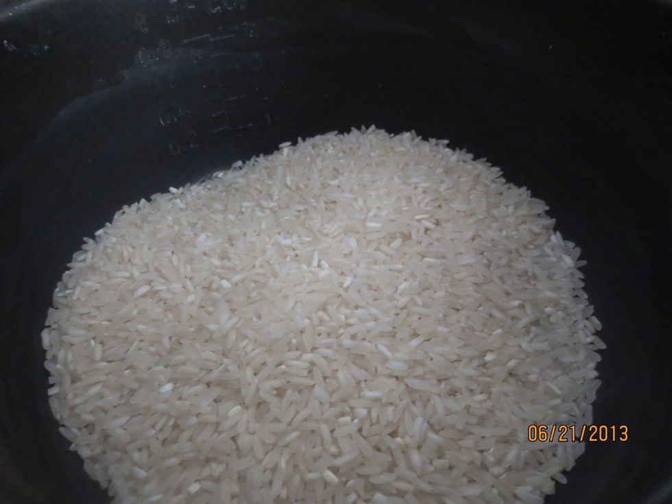 Make the rice! For one person one cup should be more than enough, measure accordingly