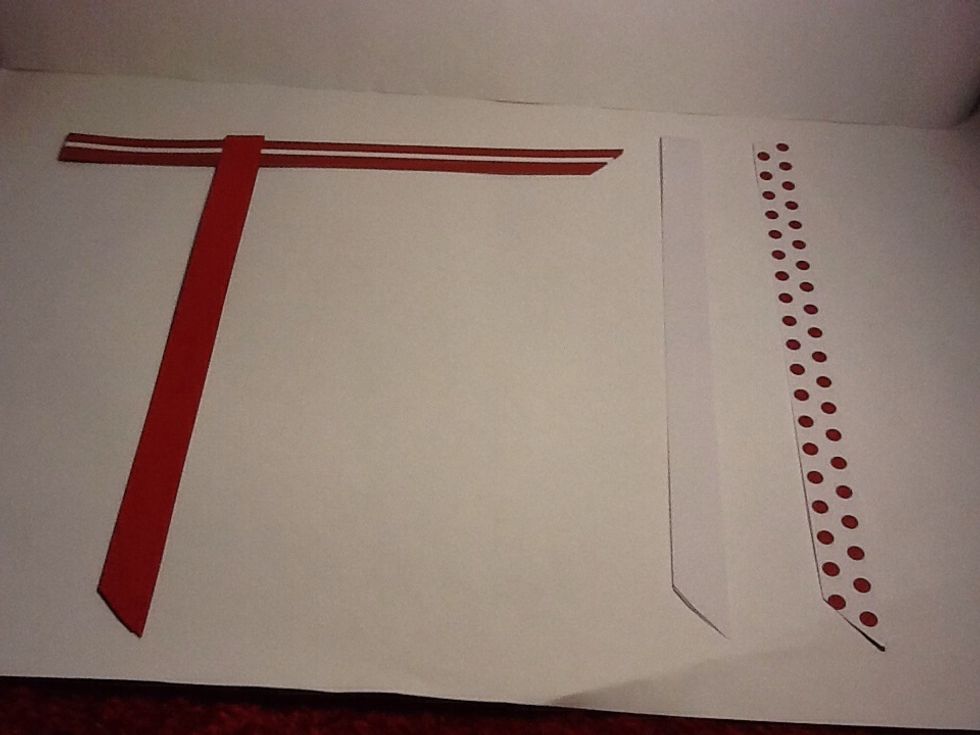 Make the stripy one go though the red make sure the ends face the same way as on this picture