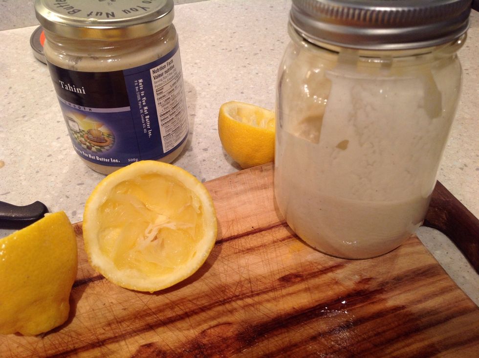Make the tahini dressing while the falafel dough is chilling. Mix Tahini, lemon juice, and crushed garlic in a jar. Add water, as needed, to make it drizzly.