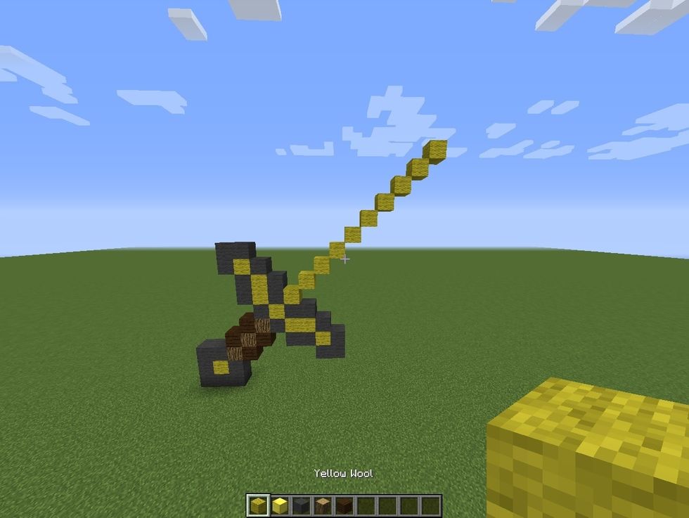 Make this ten block long diagonal line of yellow wool.