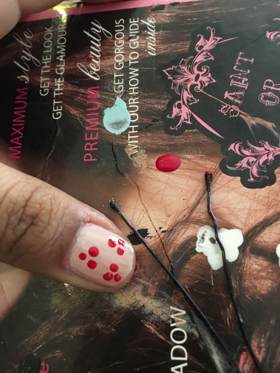Make three dots with a bobby pin
