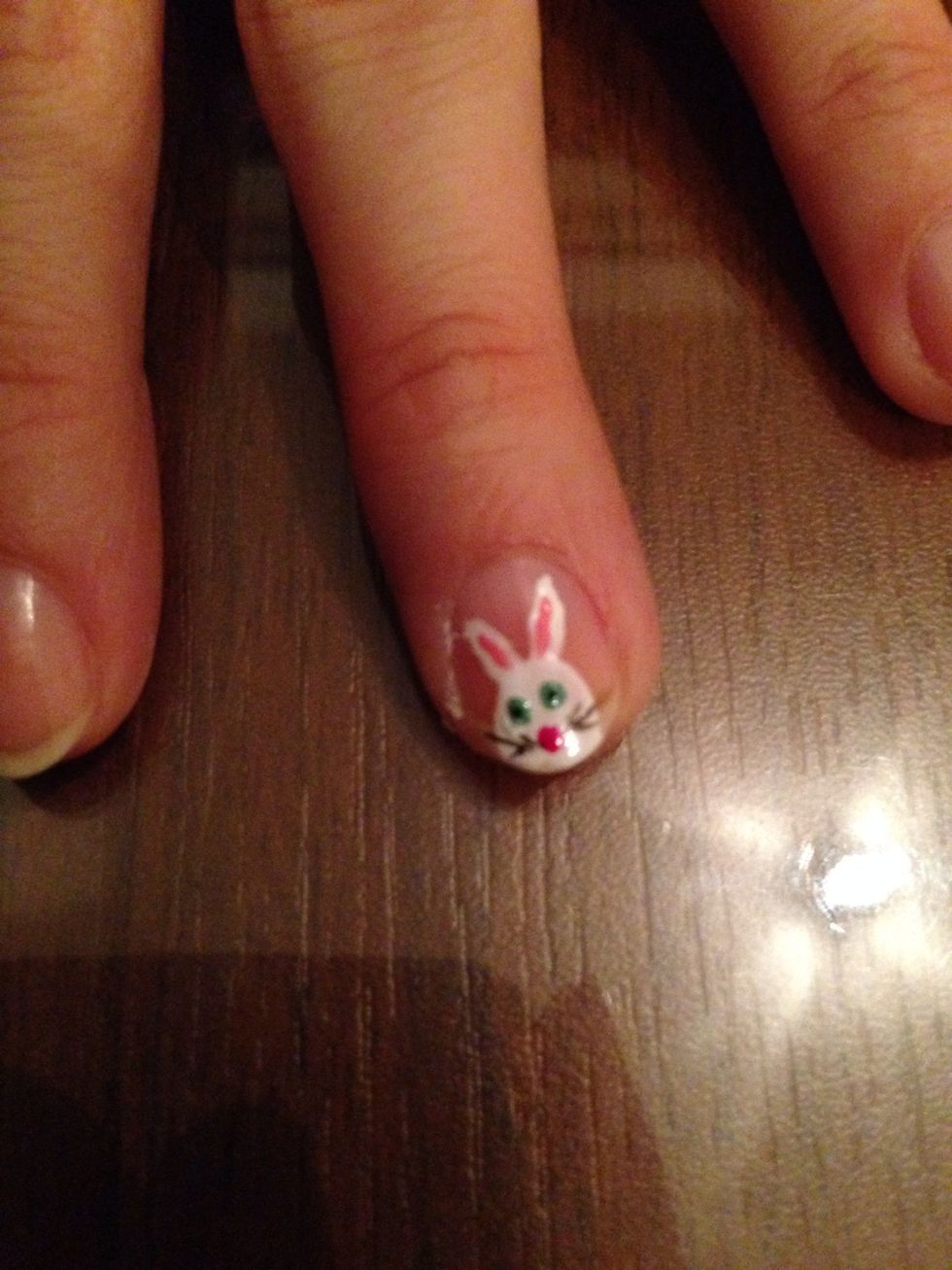 Make three lines near the nose's both sides with black nail polish. Whiskers!