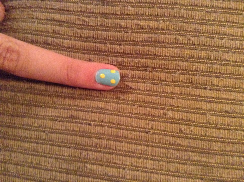 Make three yellow dots with the bigger dotting tool.