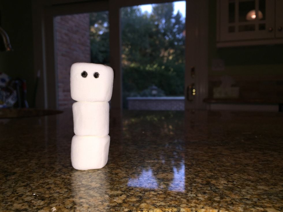 Make two black dots at the top of marshmallow #1 for eyes.