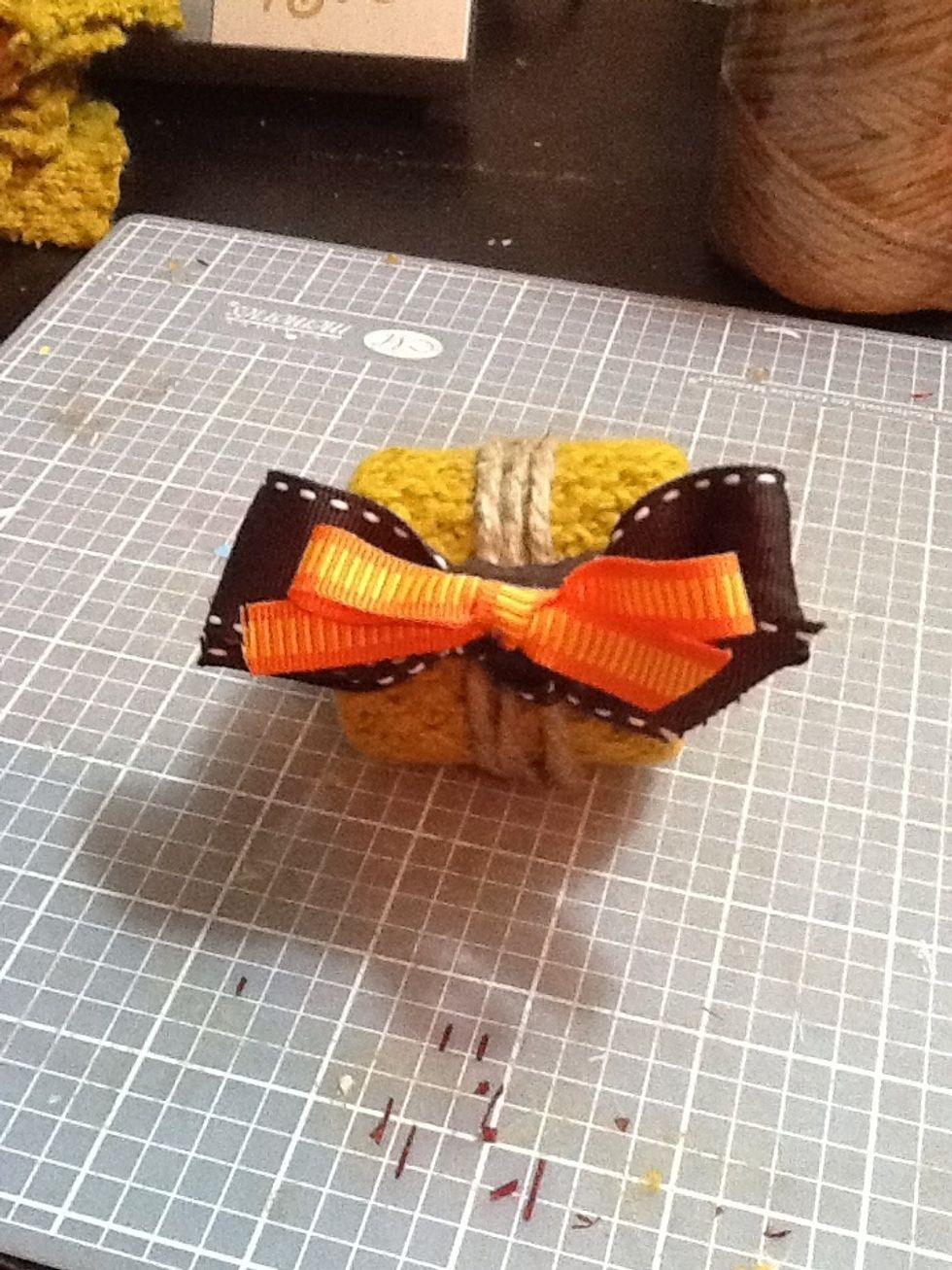 Make two bows and glue the to the opposite side of where the jute ends meet so you can't see the meets.