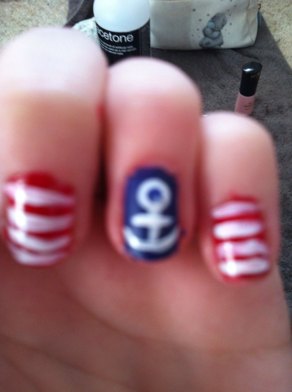 make two curved lines from the bottom of the line before and a small one across it