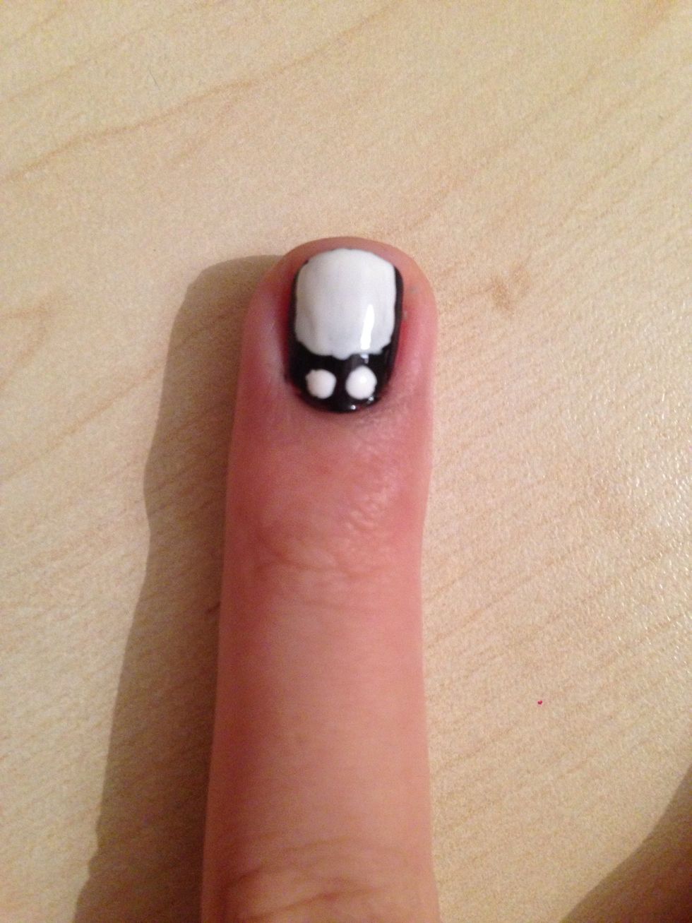 Make two dots with your toothpick